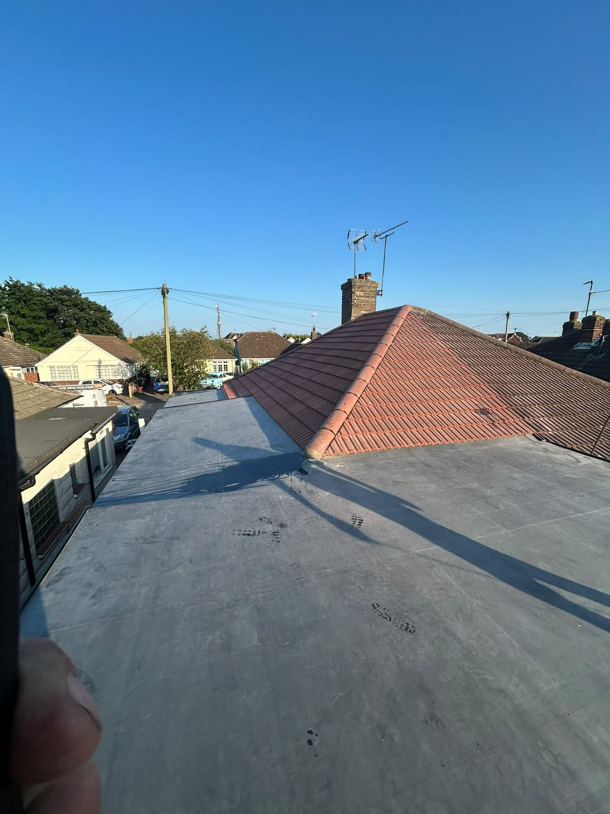 Completed roof covering with new ridge tiles